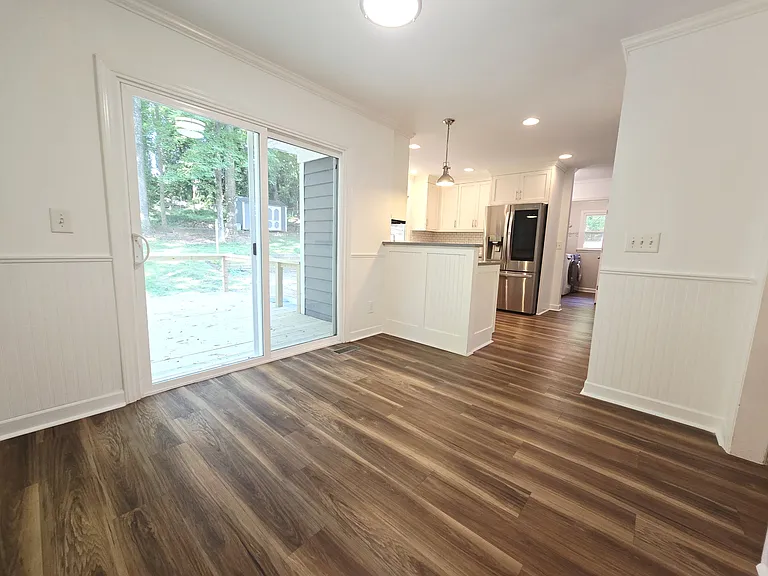 Kitchen and eating nook with sliding door onto the back deck