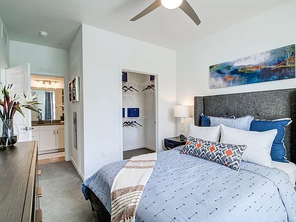 Bedroom with ceiling fan and carpeted flooring