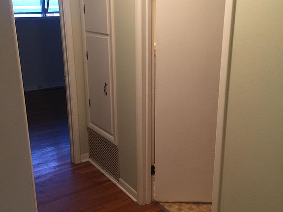 Hallway with linen/towel storage.