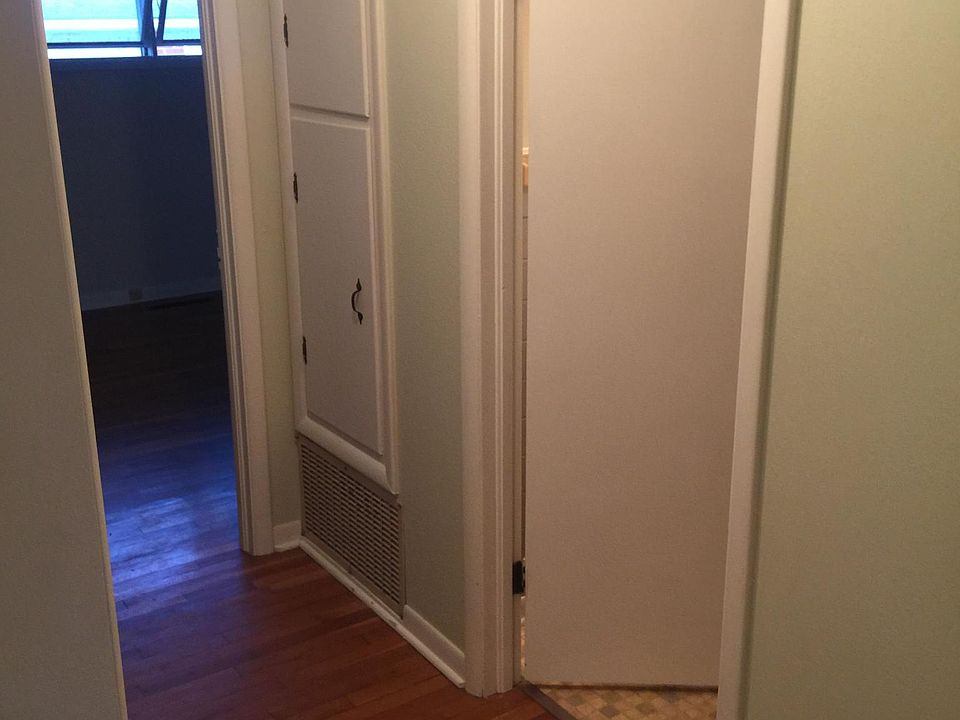 Hallway with linen/towel storage.
