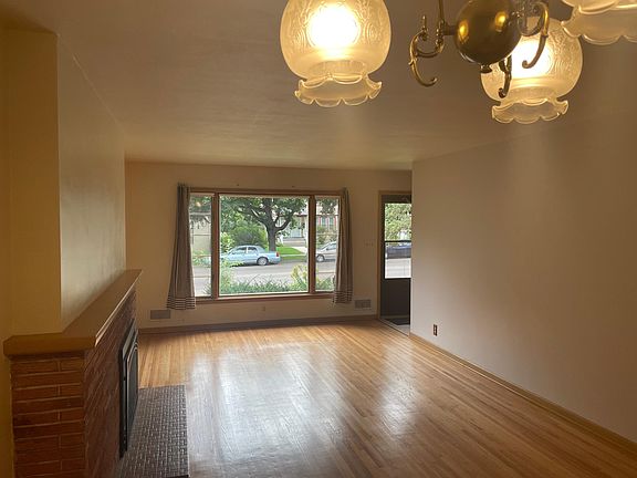 living room looking towards front picture window and door