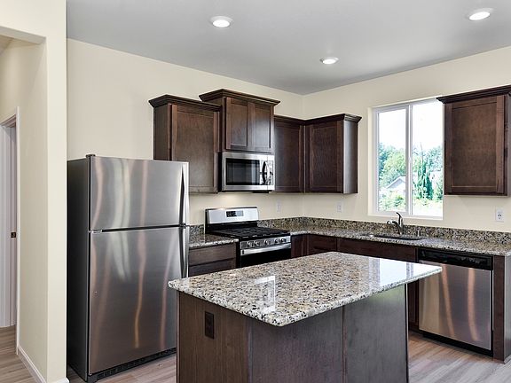 The chef ready kitchen comes with stainless steel appliances and granite countertops