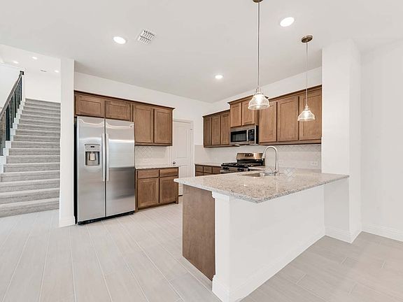 Eastholme floor plan by Pacesetter Homes featuring a 3-bedroom layout with open living and dining ar