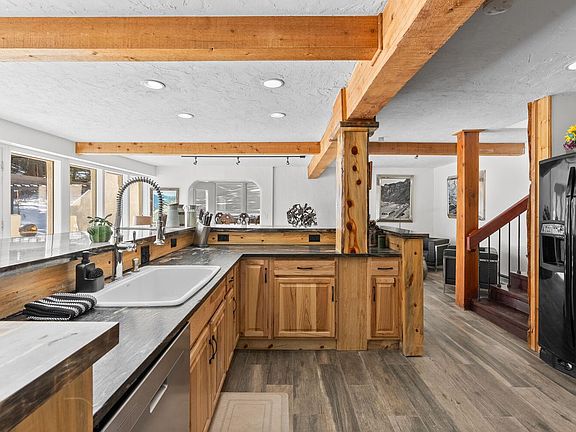 Large kitchen equipped with appliances and a countertop bar