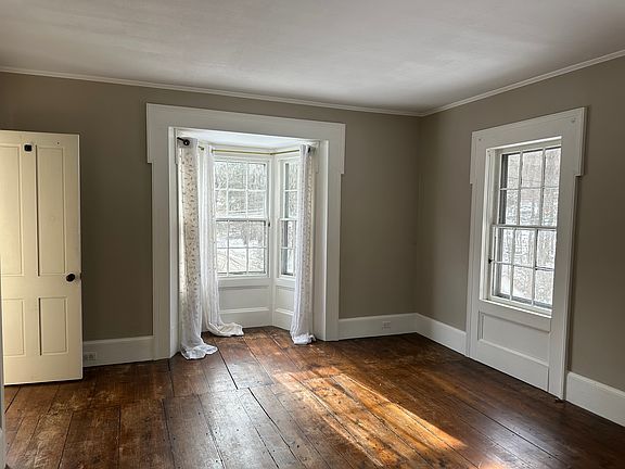 Looking in from the door at top of stairs. The open door is to closet.