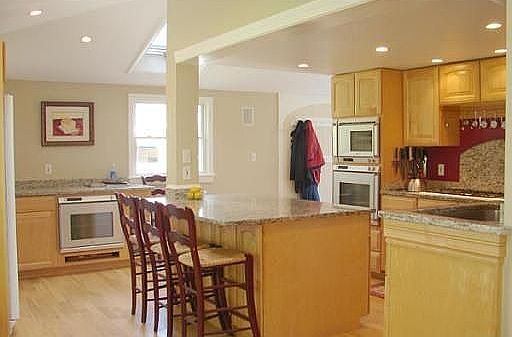 Updated kitchen with nice quality materials including granite and custom tile