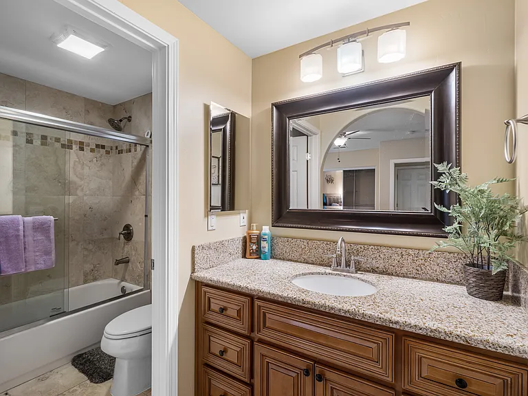 Fully stocked bathroom with essentials and a hairdryer.