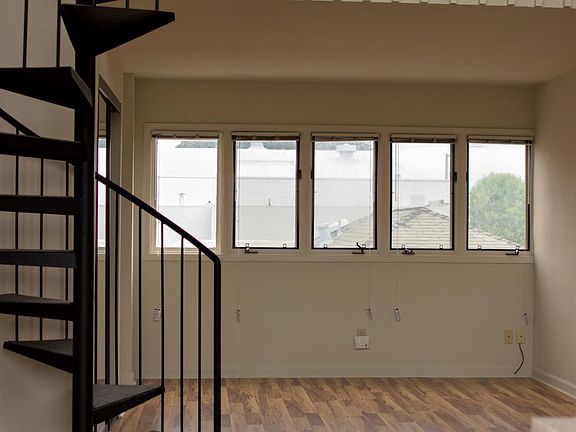 Living Room & Stairs leading to loft bedroom.