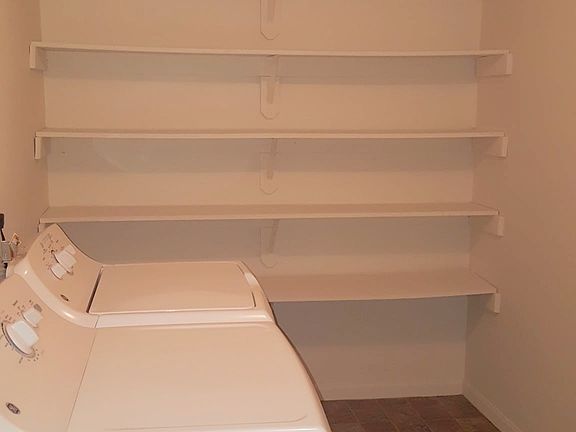 Huge laundry room with extra storage space