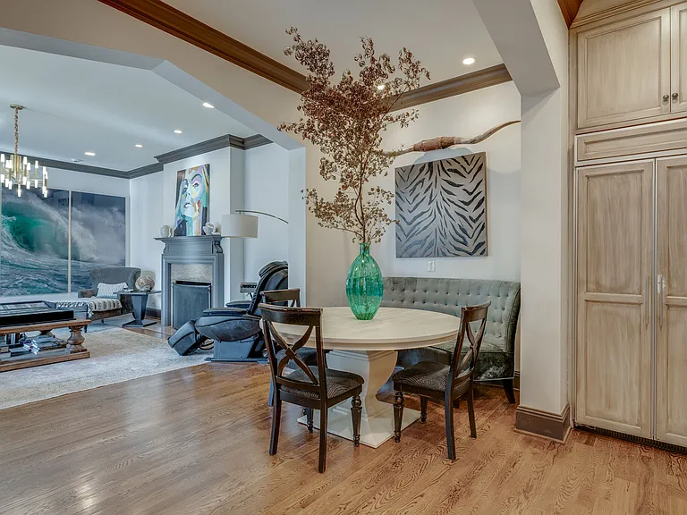 informal eating off kitchen with round table and banquet seat