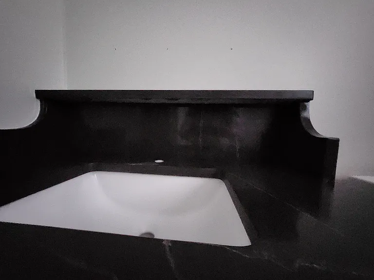 CUSTOM SHELF QUARTZ COUNTER AWAITING GOLD FAUCET AND LED MIRROR WITH DE-FOGGER