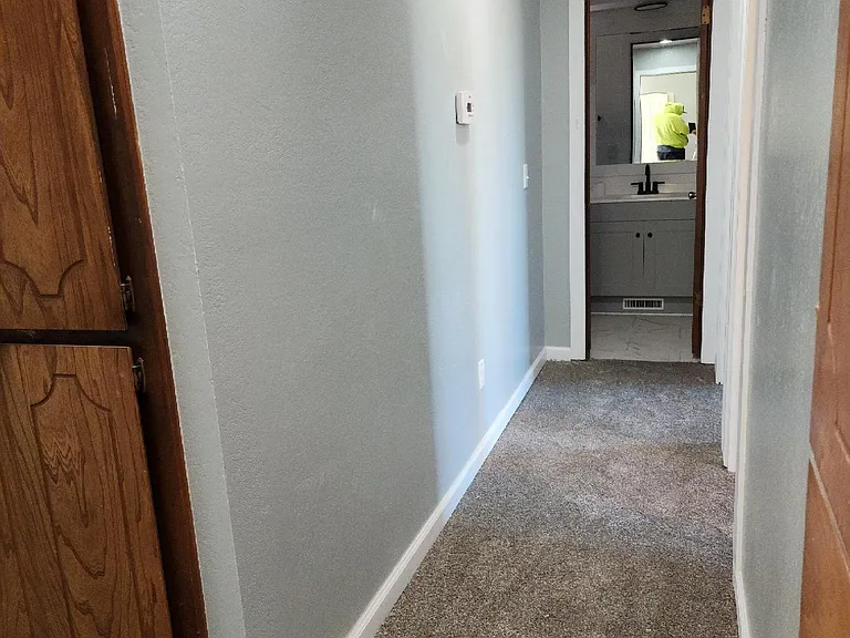 Hallway to 2 bedrooms and bathroom