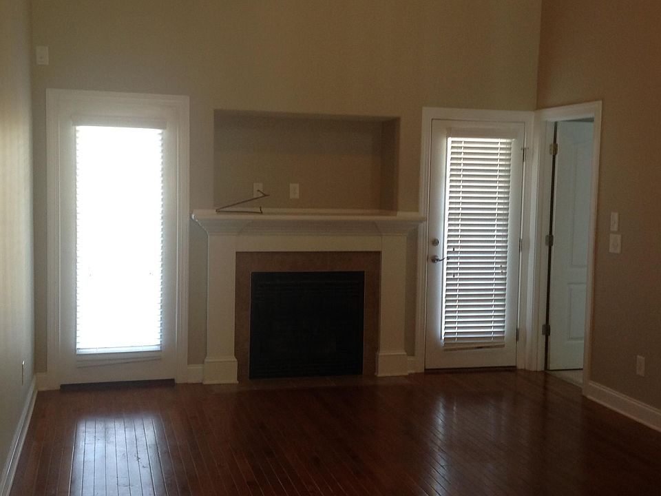 Large living room with fireplace, built in media
