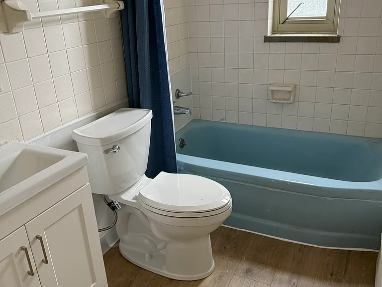 Updated floor and toilet and vanity