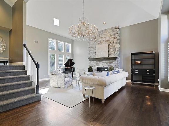 Instant WOW w/ 1940's chandelier and 2-story stone fireplace