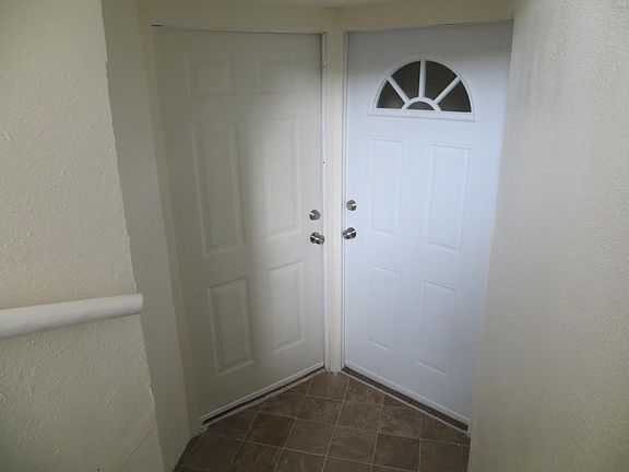 entrance at bottom of stairs