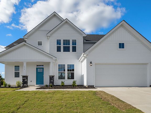 2 story single family home, all white with a 2 car garage