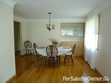 Dining Room
						:
						View from hallway into dining room. Built in china cabinet on left