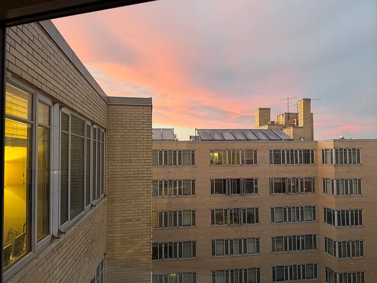 Beautiful sunset views from one of the many windows in this light-filled unit.