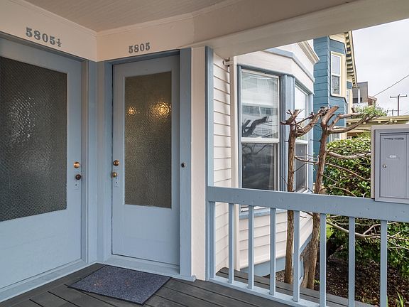 Front Door and Bay Living Room Window