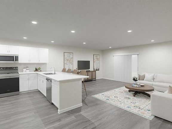 Or, you might choose to use the space for a large sectional - Azalea townhome by Highland Homes Art