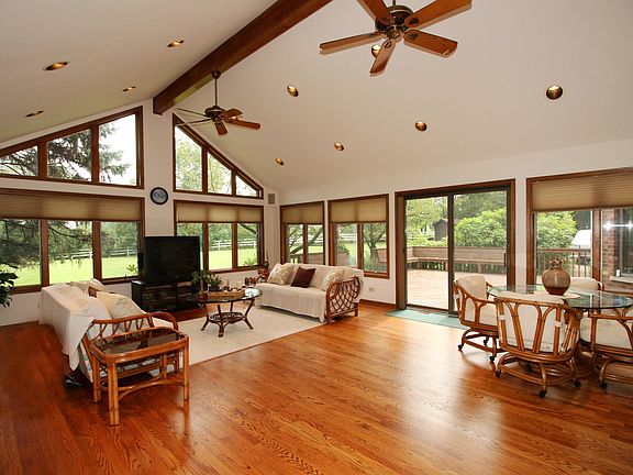 ENJOY THE 30X19 OPEN AND BRIGHT SUNROOM, WITH WALLS OF WINDOWS