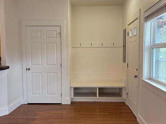 Front entry, coat closet with sitting area and shoe storage