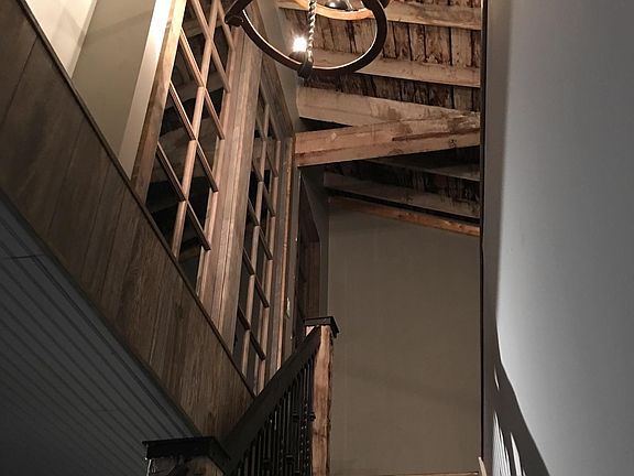 Unique handcrafted stairway leads to huge game room and 2 more large bedrooms and a new bathroom w jacuzzi soaking bath tub.