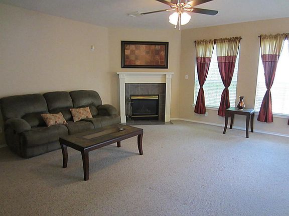 View of family room from entrance.  Notice fireplace in rear.