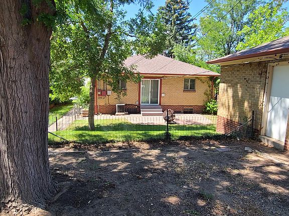 Back of house; patio door off dining area