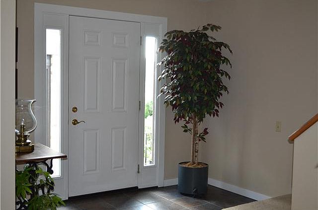 Entry Foyer with Tile Flooring & Coat Closet