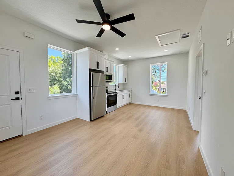 Open kitchen and living space with ample natural light.