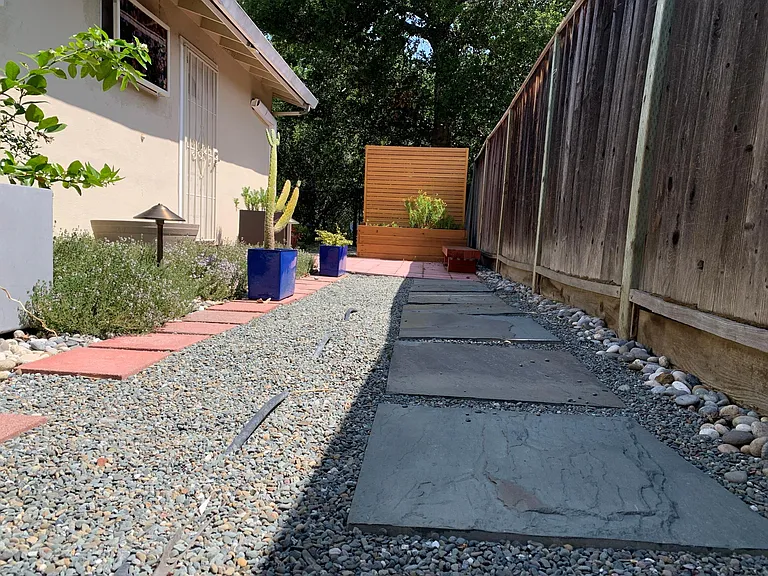 Beautiful side garden and bluestone pathway to entrance