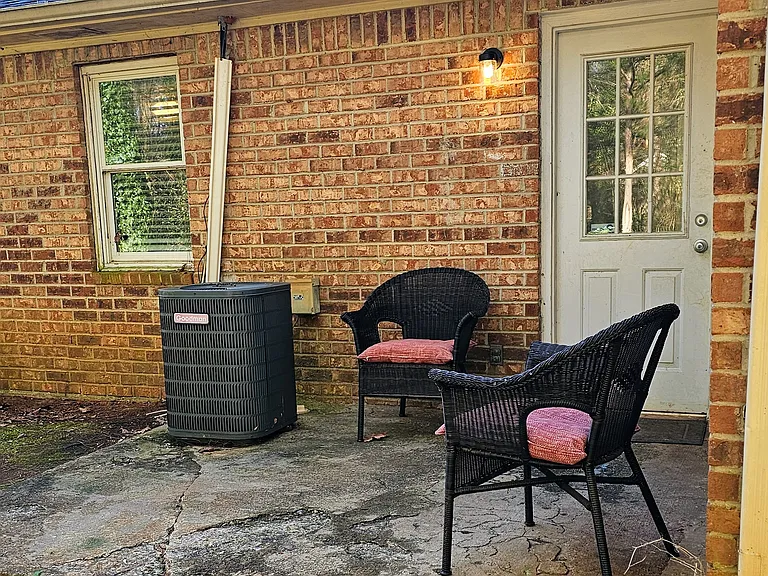 private patio, with wooded view out back