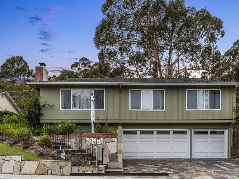 The single car garage on the right belongs to this duplex unit.