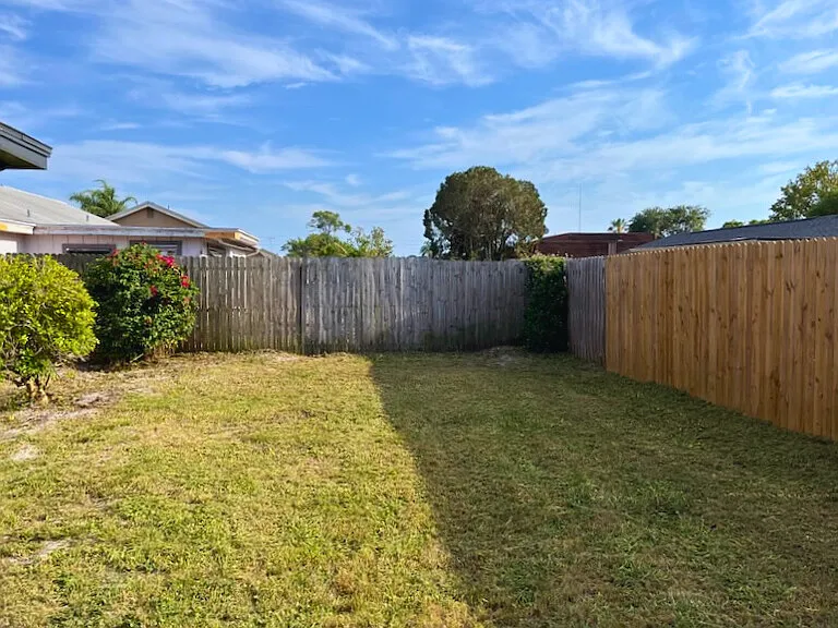 Fenced-in back yard.