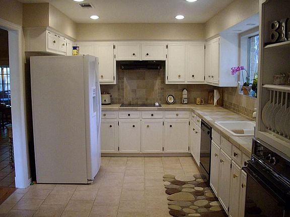  Kitchen with new tile counter top and back splash.  Plenty of storage and space.