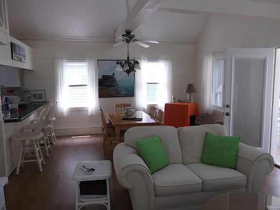 Living room/ dining room
						:
						Light & airy, vaulted ceiling. Lots of windows for a nice summer breeze.