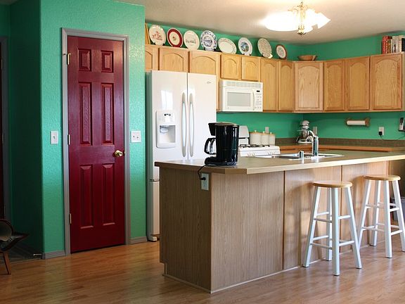Kitchen : Pantry door on left, sink on island