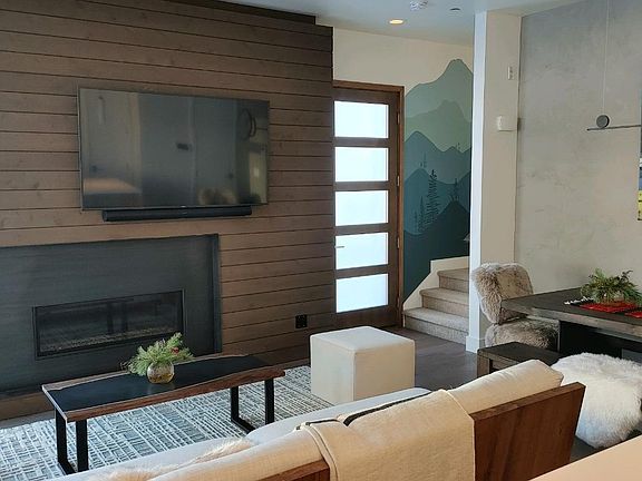 Front door and stairwell leading to upstairs bedrooms