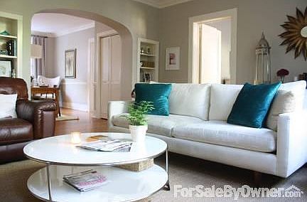 Living Room - 4
						:
						Built-in bookshelves beside large archway leading to dining room.
