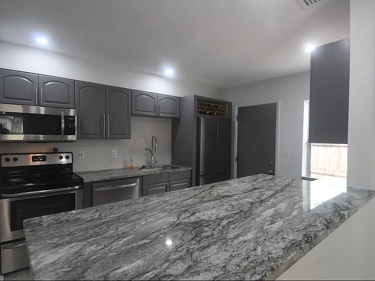Kitchen breakfast bar and window.