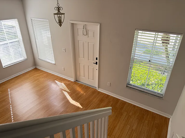 Stairs from upstairs headed down into the Living Room.