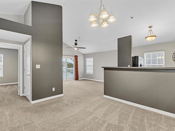 Soaring vaulted ceilings, plant shelf, fresh paint, professionally cleaned carpet.