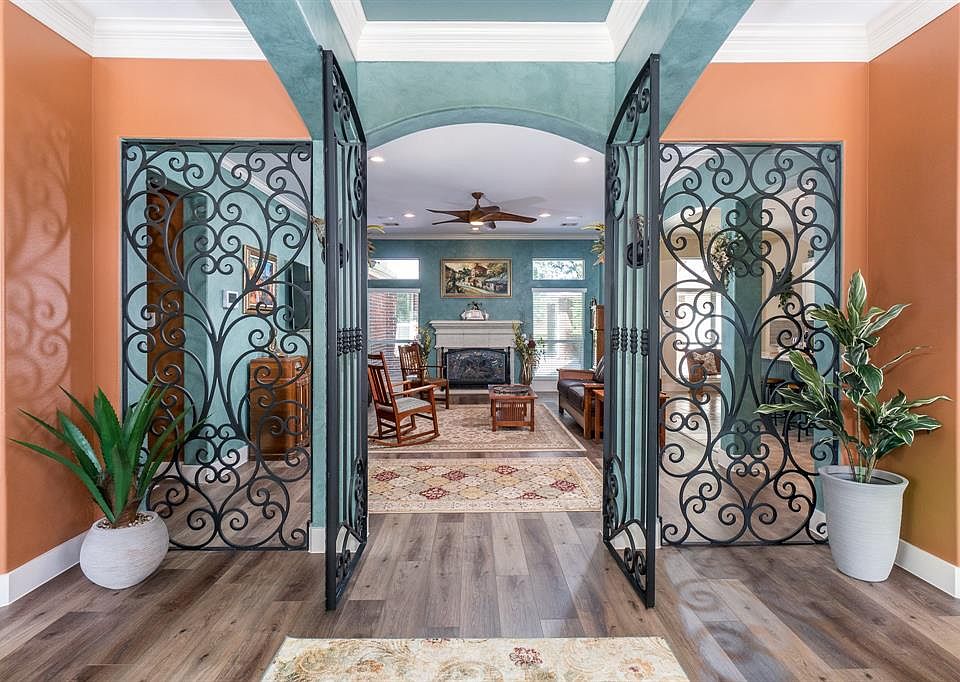 Welcome Home! When you enter you are greeted by one of a kind custom iron doors that are truly one of a kind.