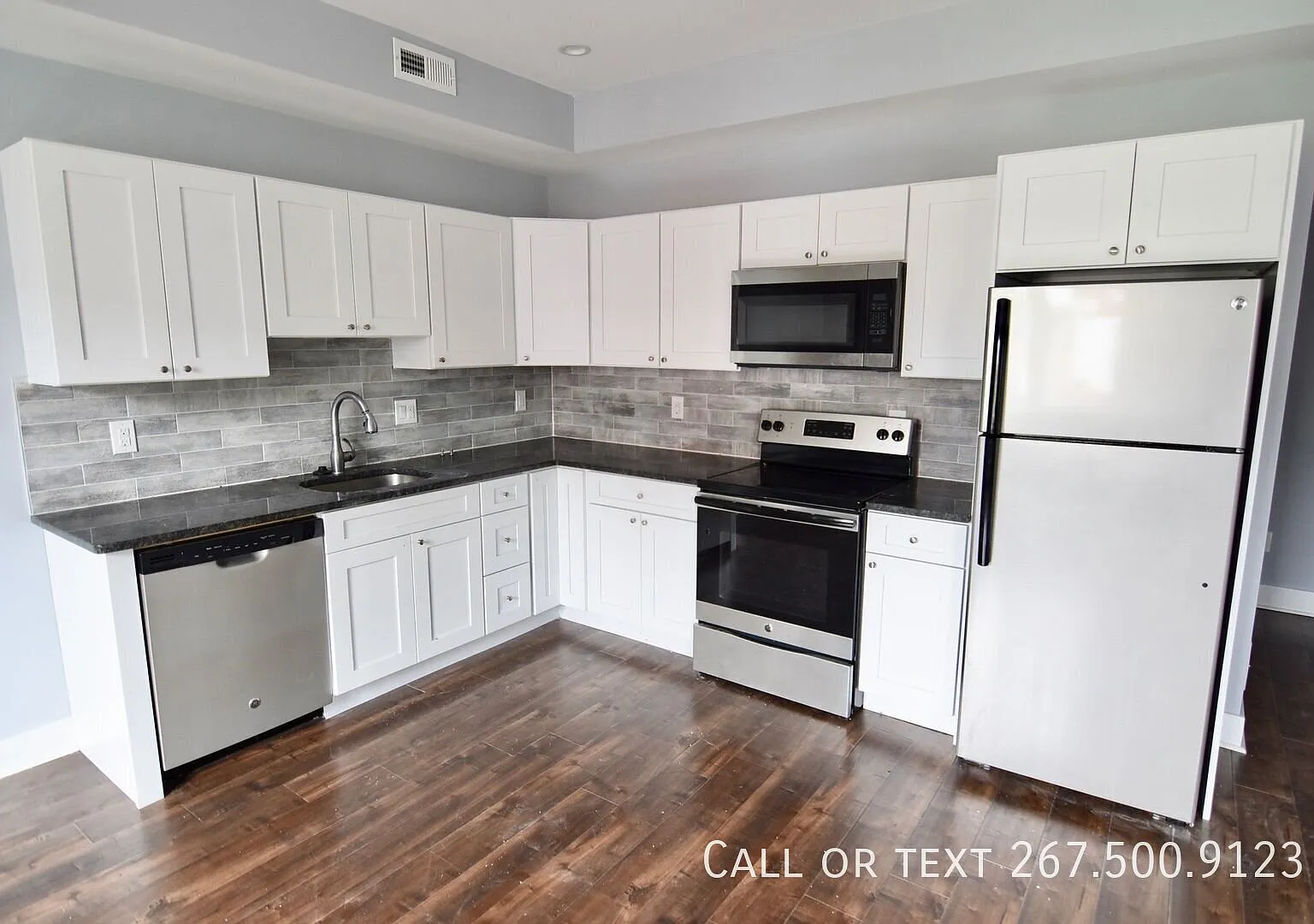 New Construction! Bi-Level two bedroom with a Roof Deck!! Great view. W/D. — Photo 1
