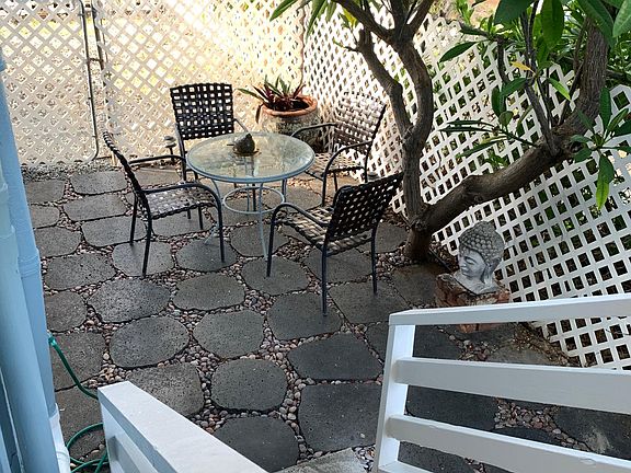 Cool shady enclosed patio with lava pavers