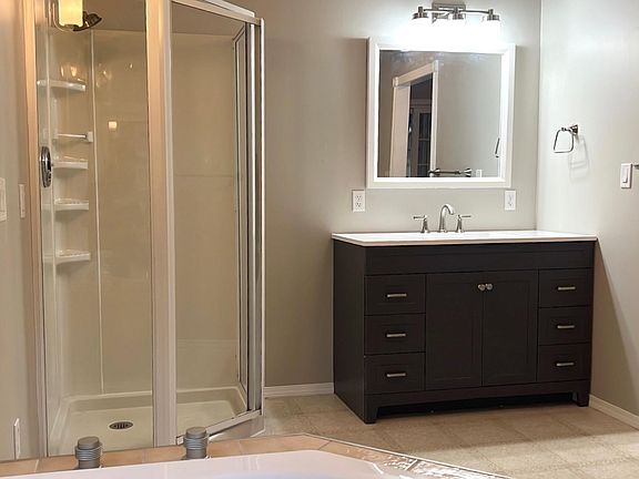 Master bathroom suite with new vanity and fixtures.