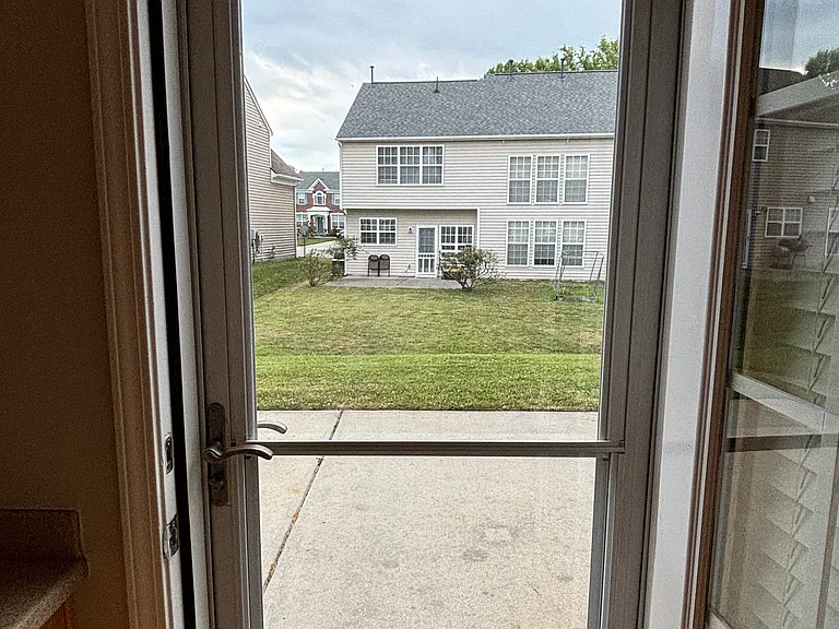 Door leading to the back yard from the kitchen
