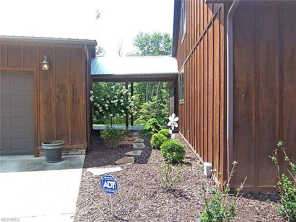 Covered entrance to over sized, heated 3+ (28x40) garage with overhead storage